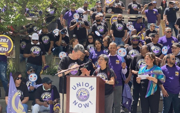 Karen Chen, Executive Director, and Jun Gao, Rideshare driver, speaking at a rally supporting rideshare drivers’ freedom to unionize. 